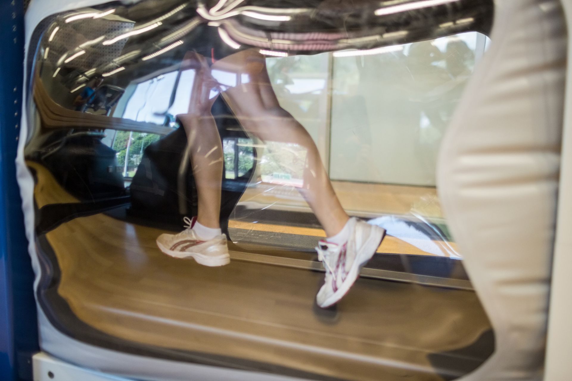 close up shot of legs running on the AlterG anti gravity treadmill,  the benefits of alterg