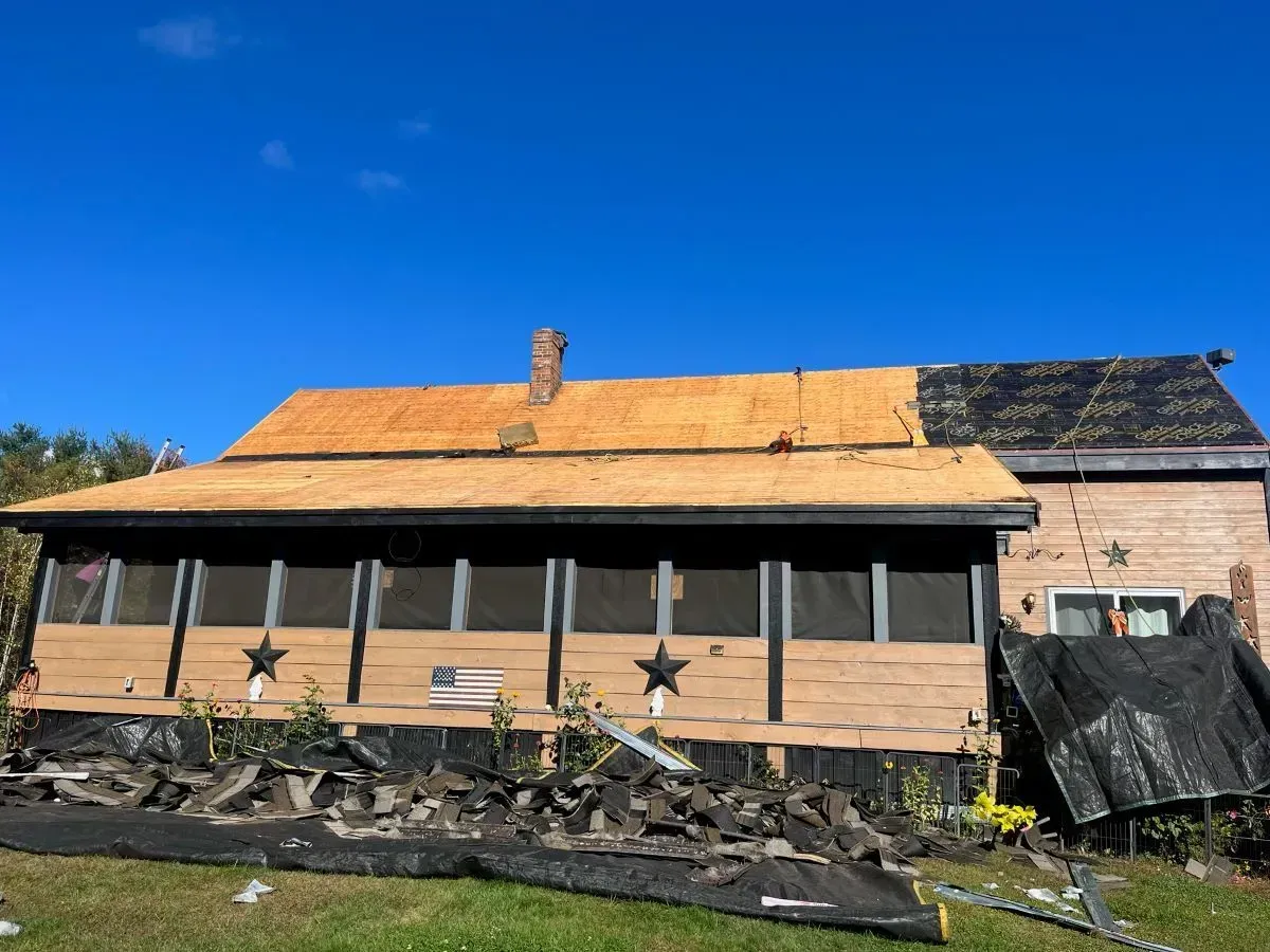 A house with a roof that is being repaired.