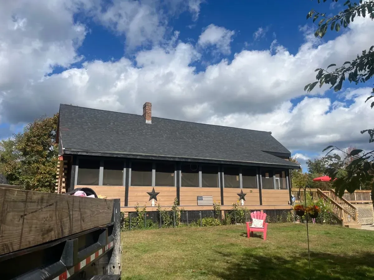 A large house with a red chair in front of it