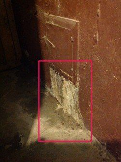 A corner of a wall with a red square around it.