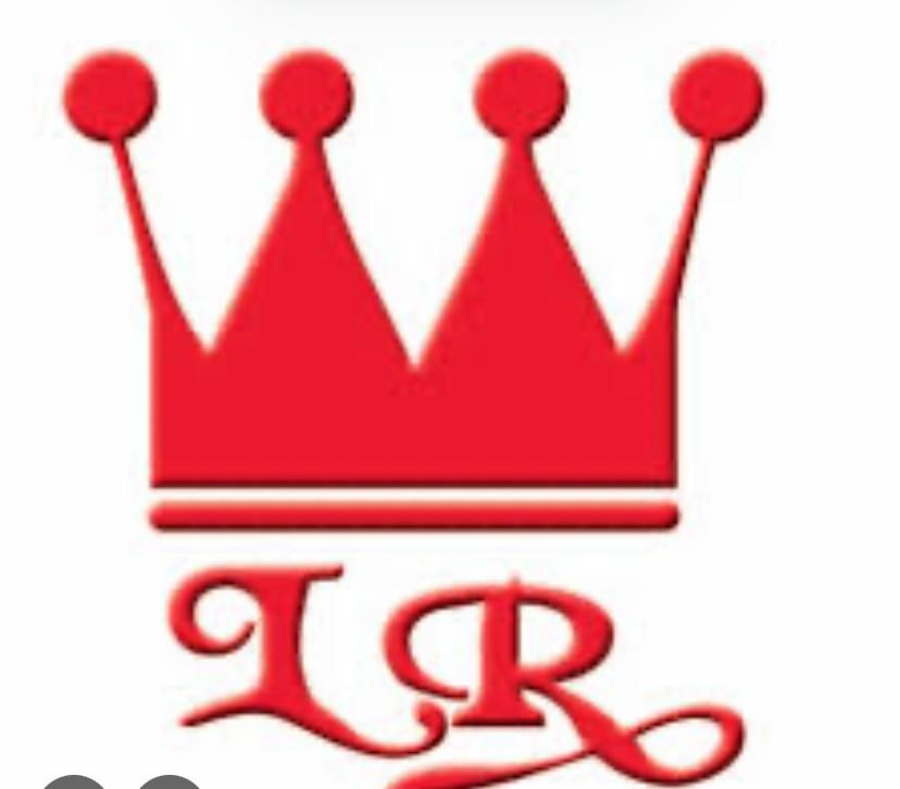 El logotipo del colegio el belloto es un escudo con un libro abierto y una pluma.