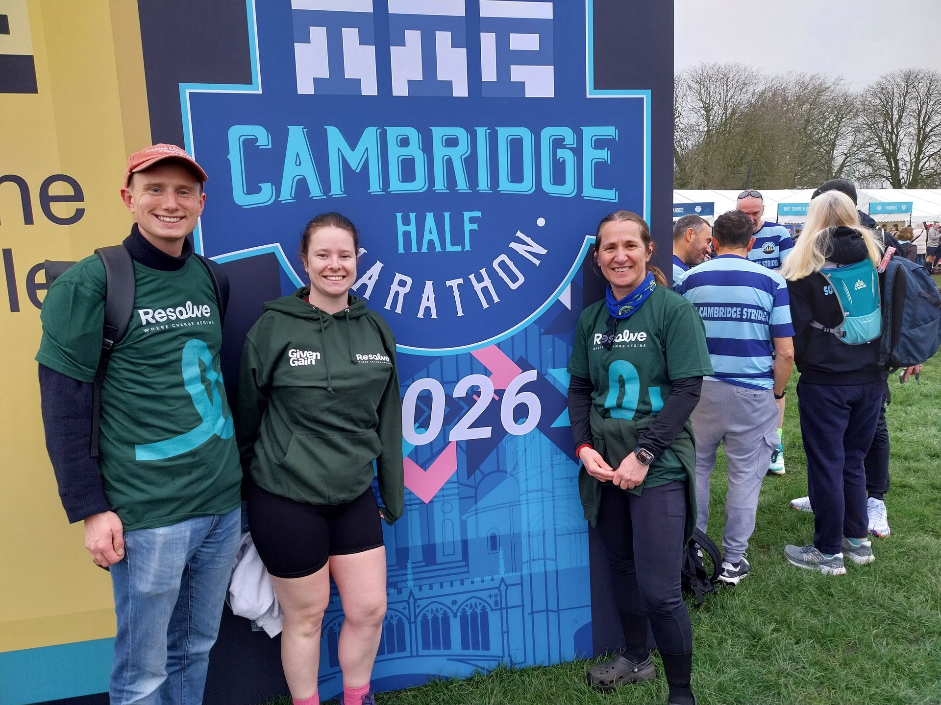 Bridge of Sighs, Cambridge, spanning a river. Stone bridge and building under a blue sky, reflecting in the water.