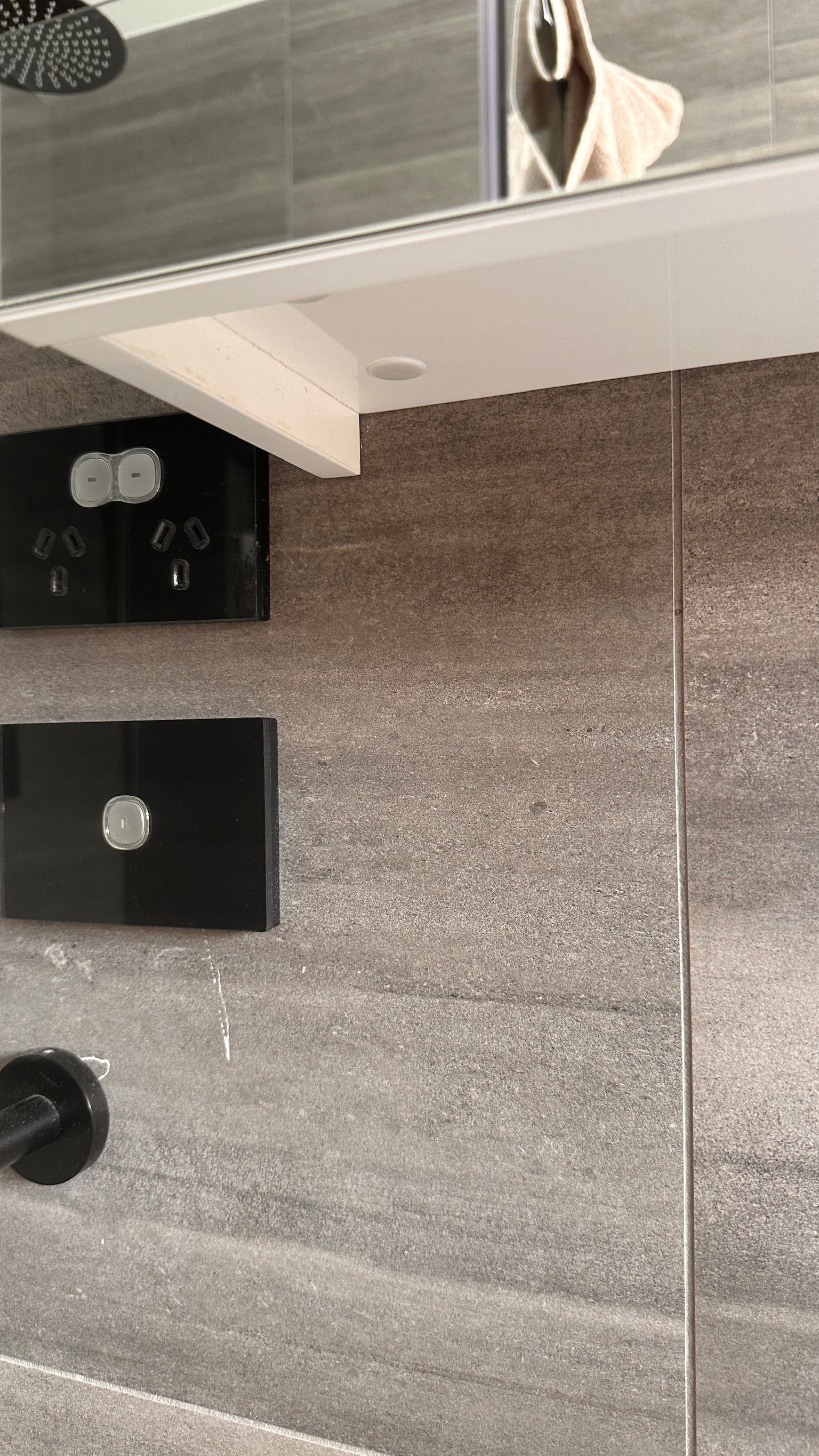 Tile wall repaired — before and after comparison