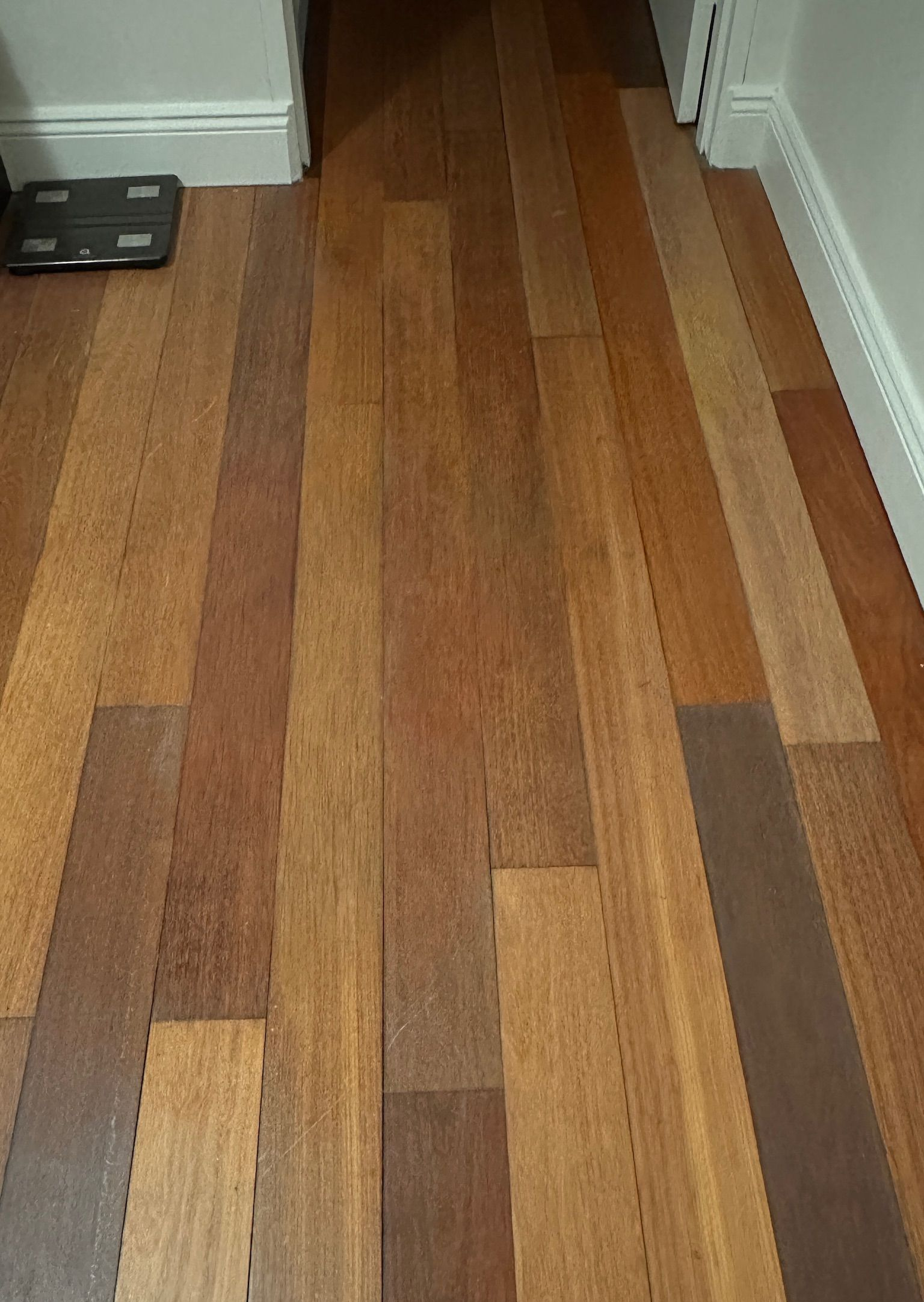 Timber floor repaired — before and after comparison