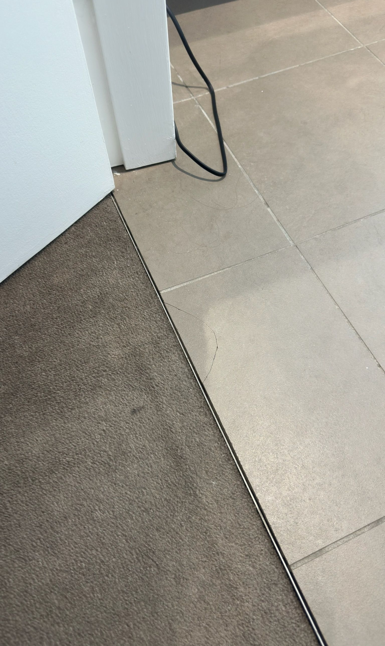 Tile floor repaired — before and after comparison