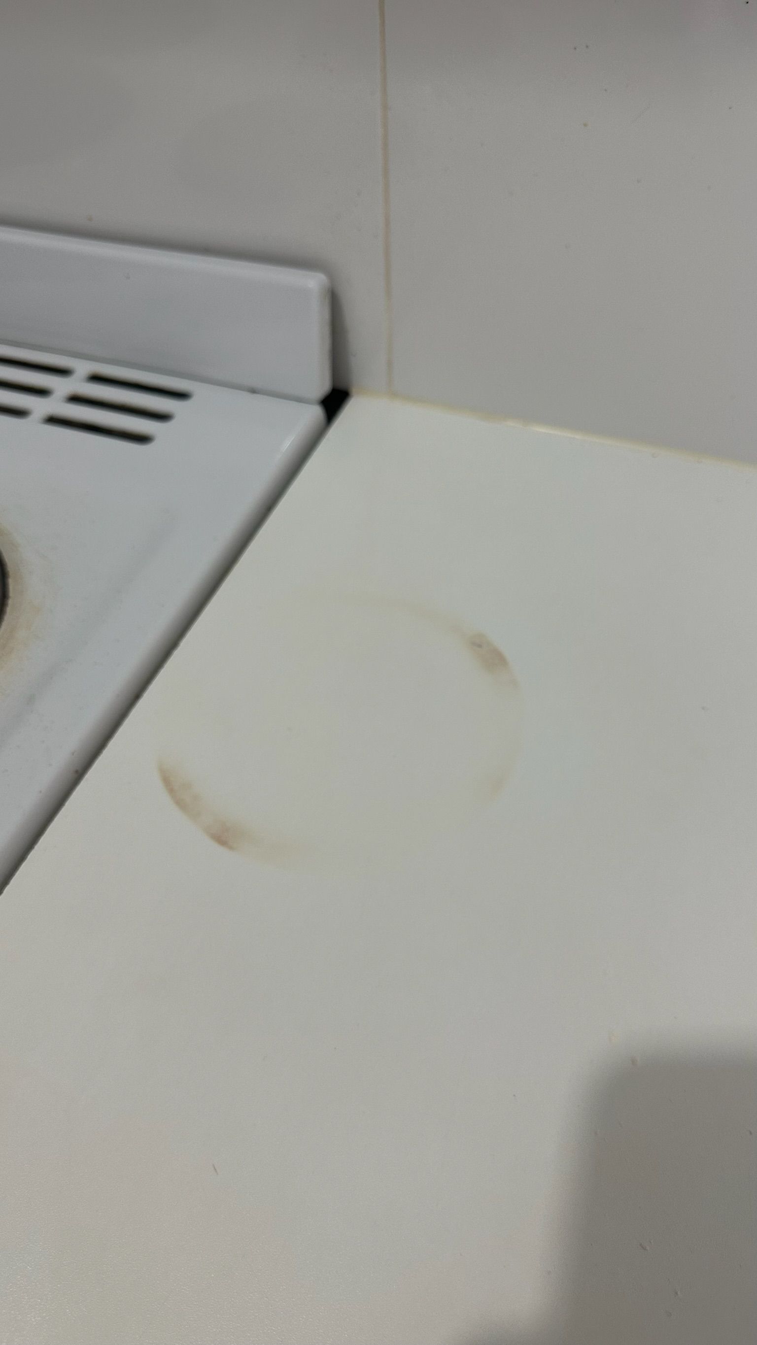 Laminate benchtop repaired — before and after comparison