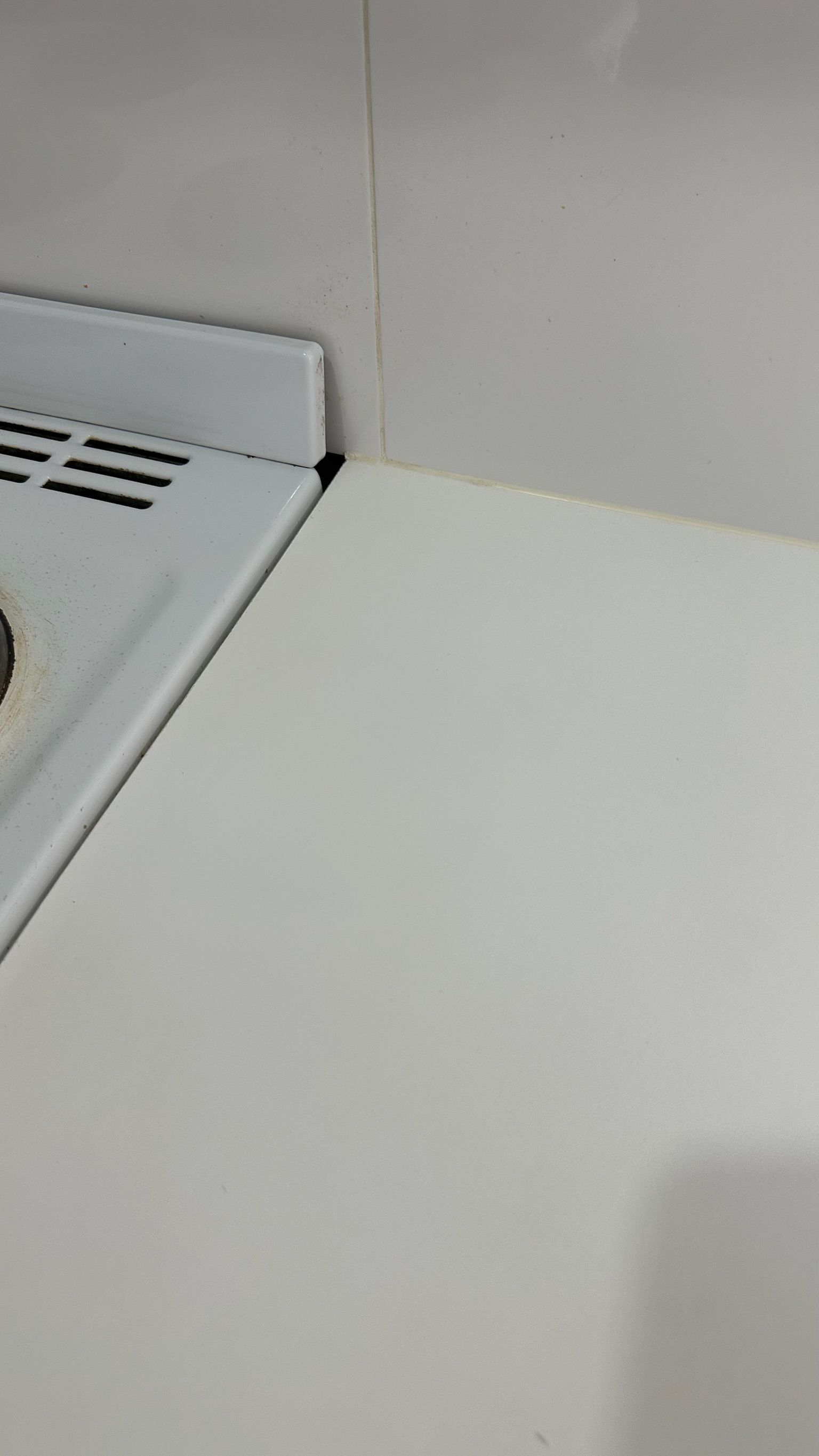 Laminate benchtop repaired — before and after comparison