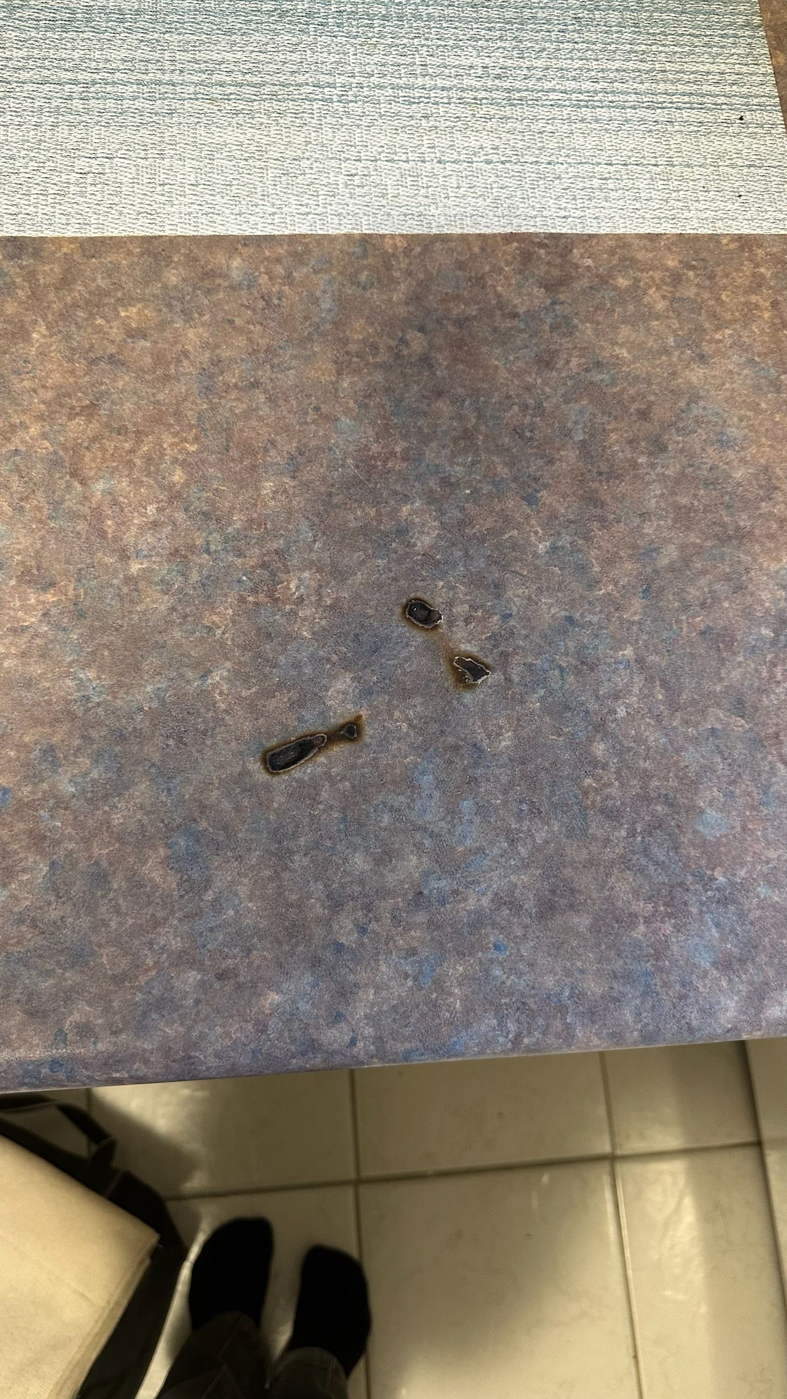 Laminate benchtop repaired — before and after comparison