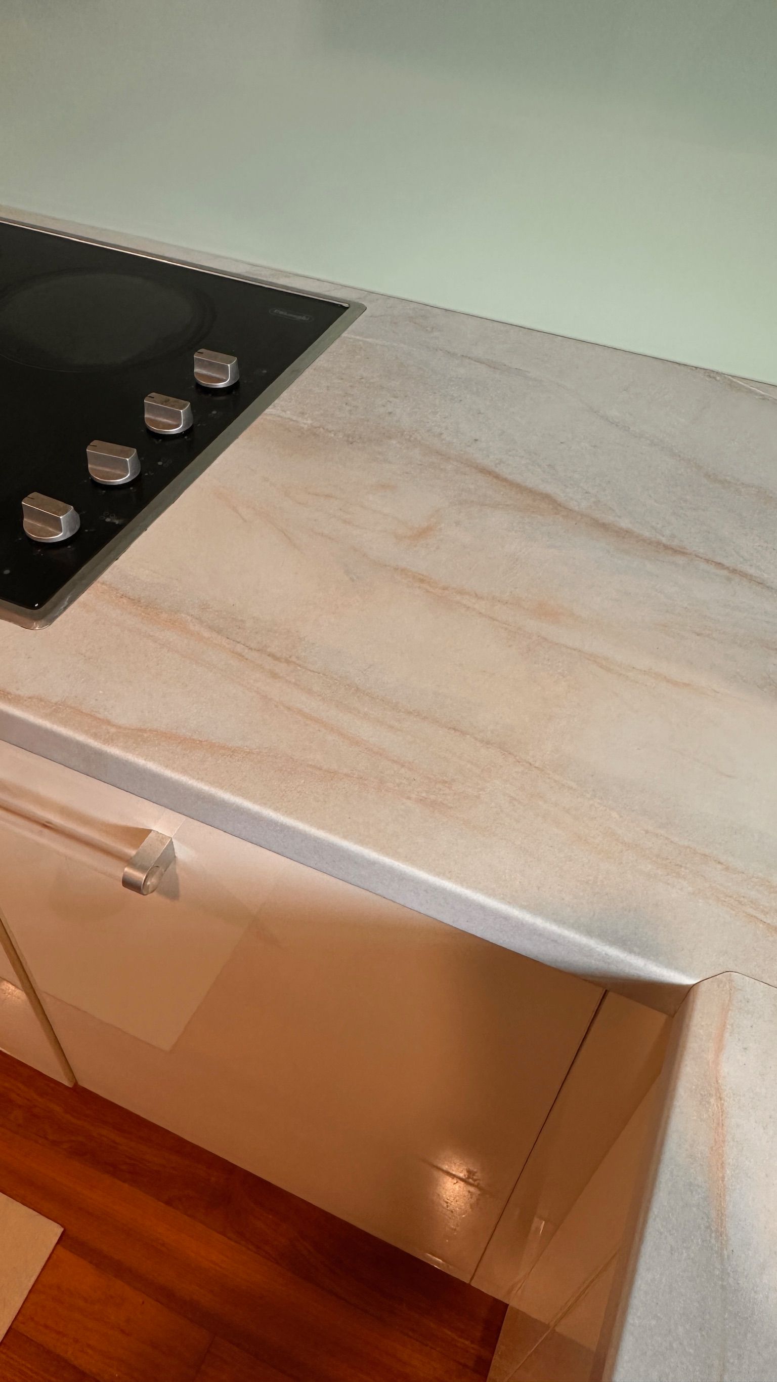 Laminate benchtop repaired — before and after comparison