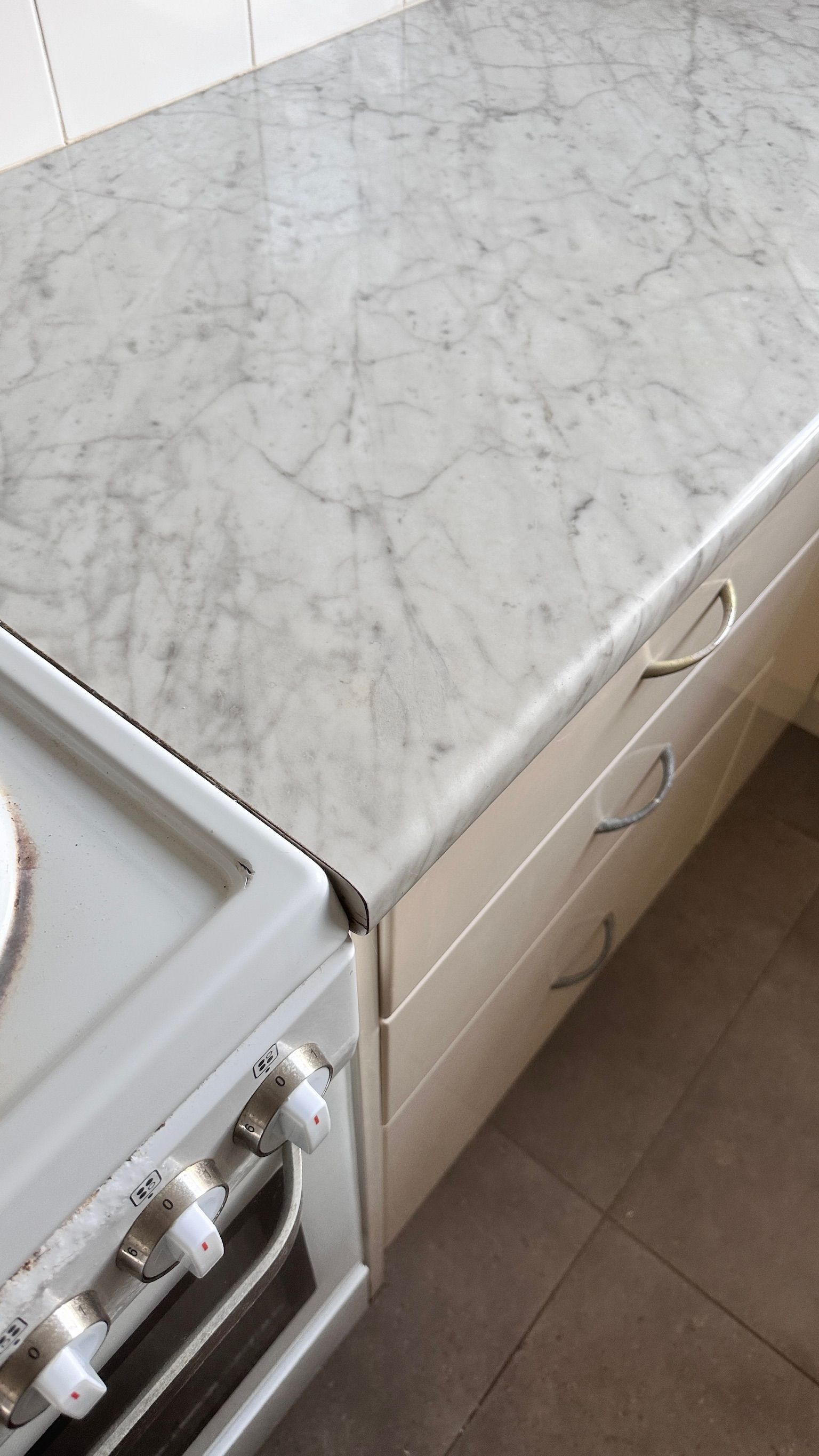 Laminate benchtop repaired — before and after comparison