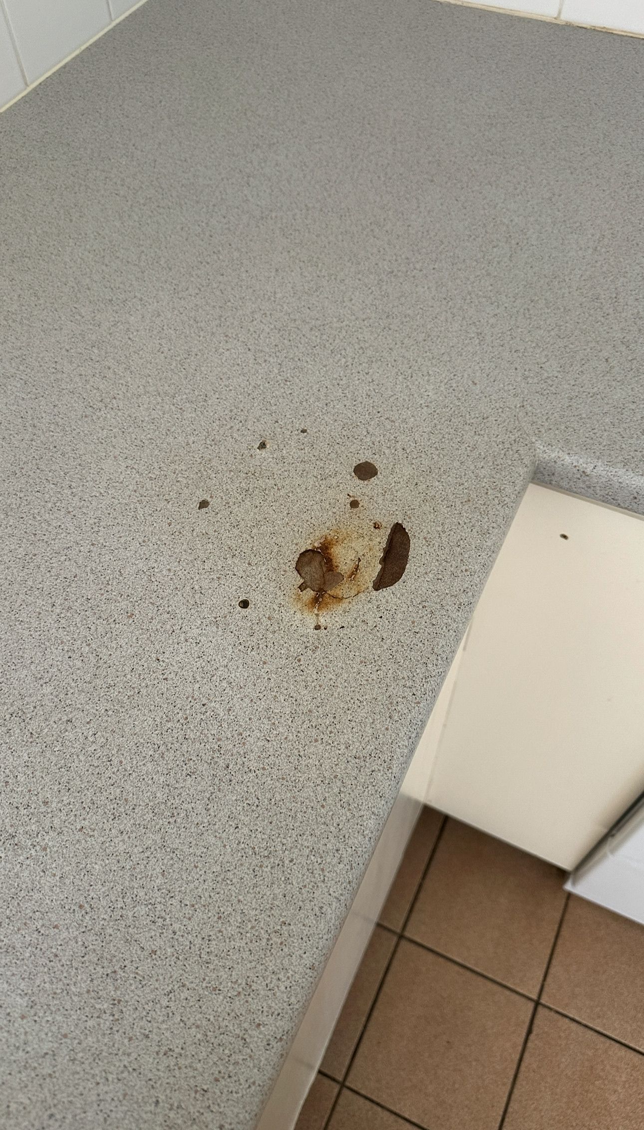 Laminate benchtop repaired — before and after comparison