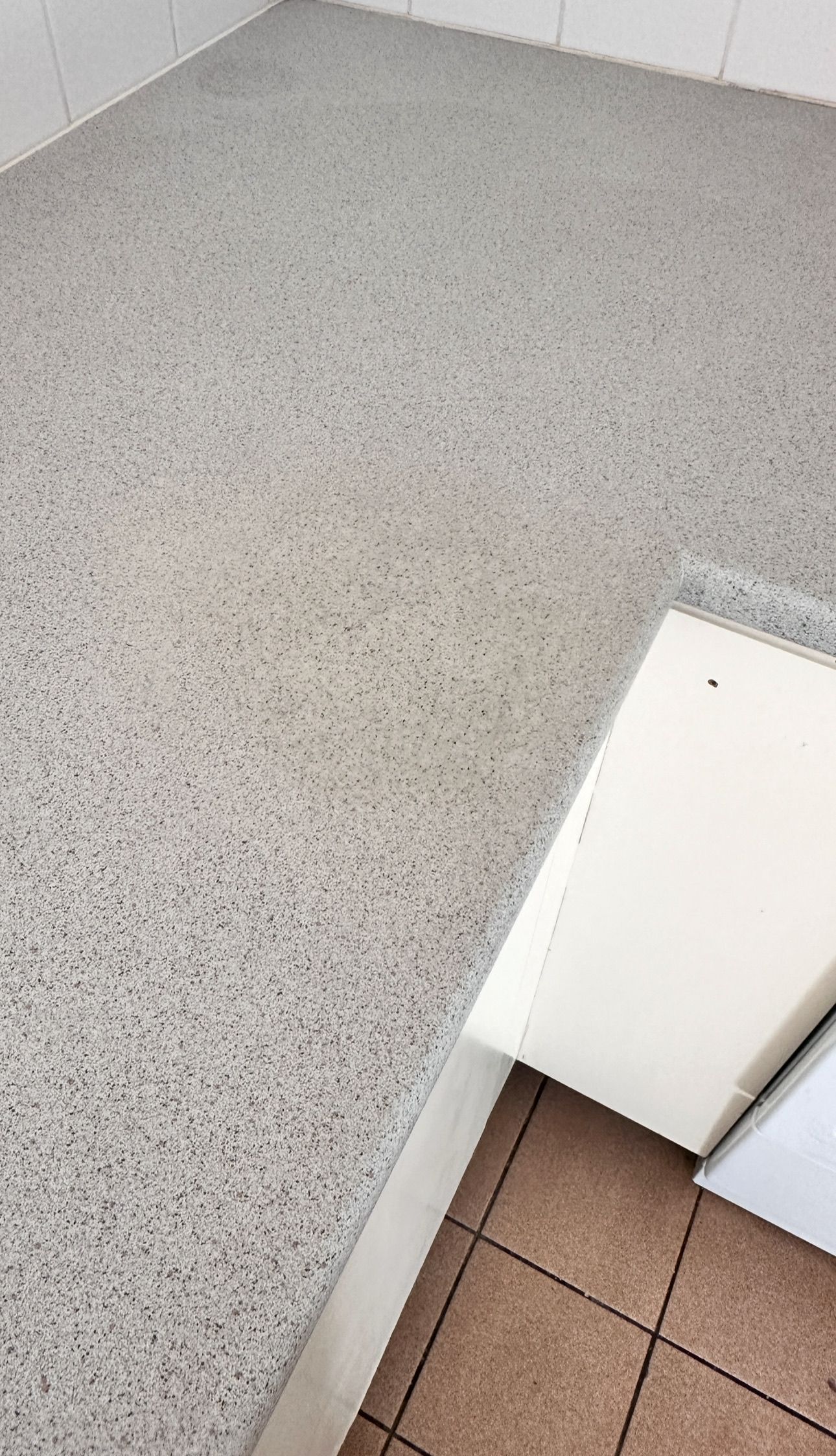 Laminate benchtop repaired — before and after comparison