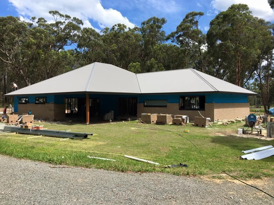 A House That Is Being Built With A White Roof — Mad About Metal Roofing & Guttering PTY LTD in Newcastle, NSW
