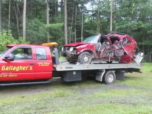 A red towing truck from gallagher 's towing