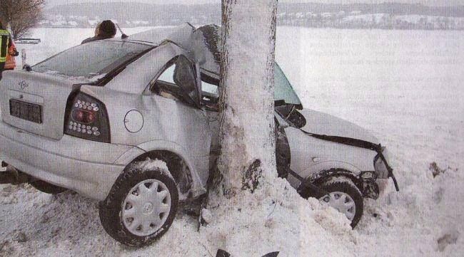 A car that has crashed into a pole in the snow