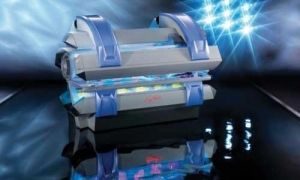 Futuristic silver and blue chest with glowing lights on a reflective surface.