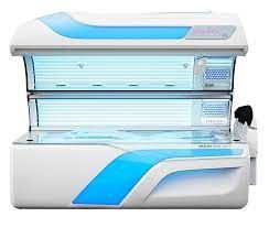 White and blue tanning bed with open top and bottom sections.