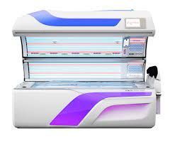 White and purple tanning bed with blue accents; control panel.
