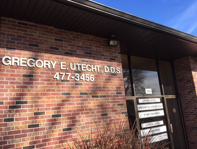 Utecht Gregory  E DDS sign mounted on the wall