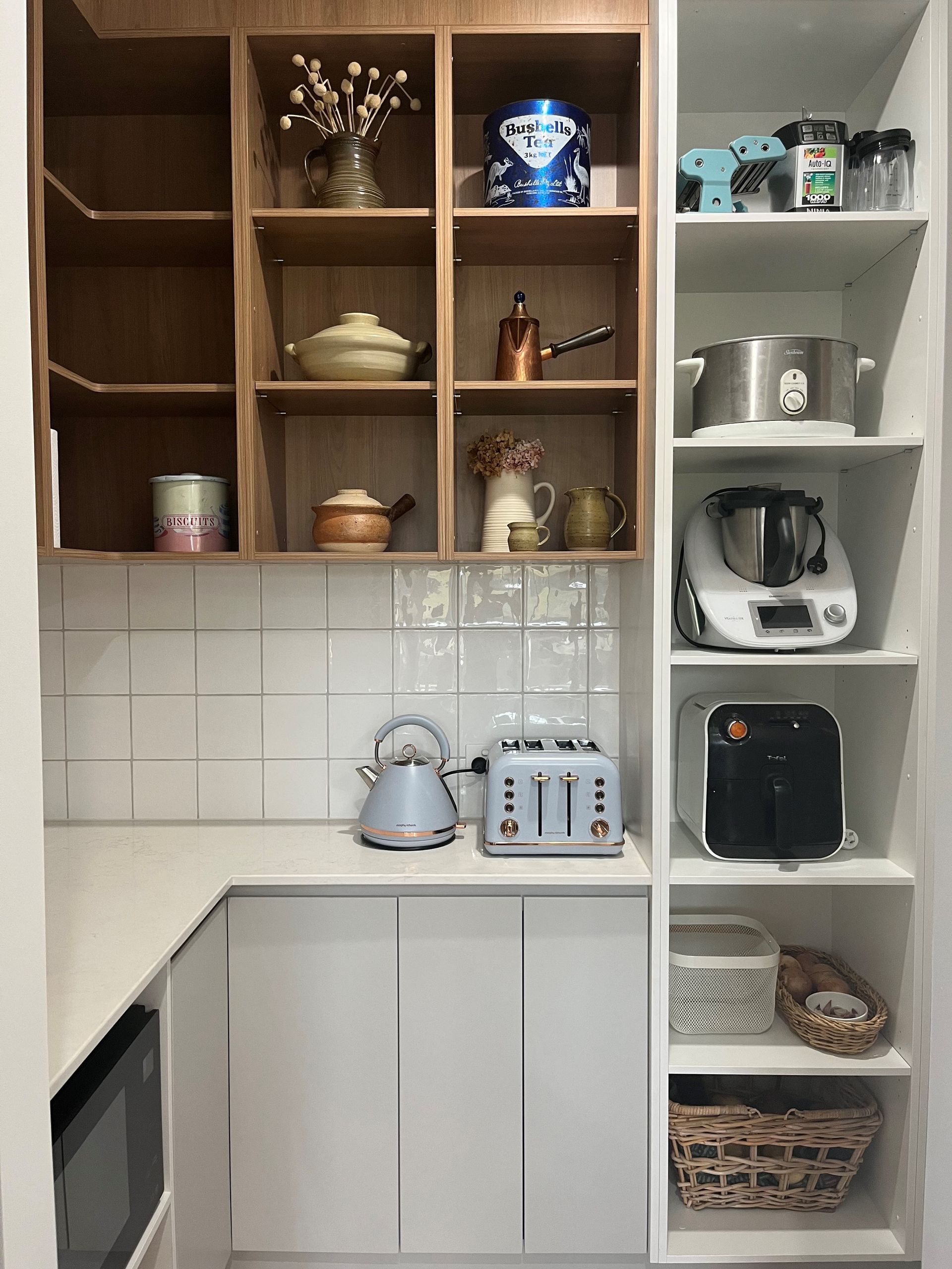 Kitchen corner with white cabinets, built-in shelves, and appliances like a kettle, toaster, and air fryer— Valley Cabinetmakers In Biloela, QLD 