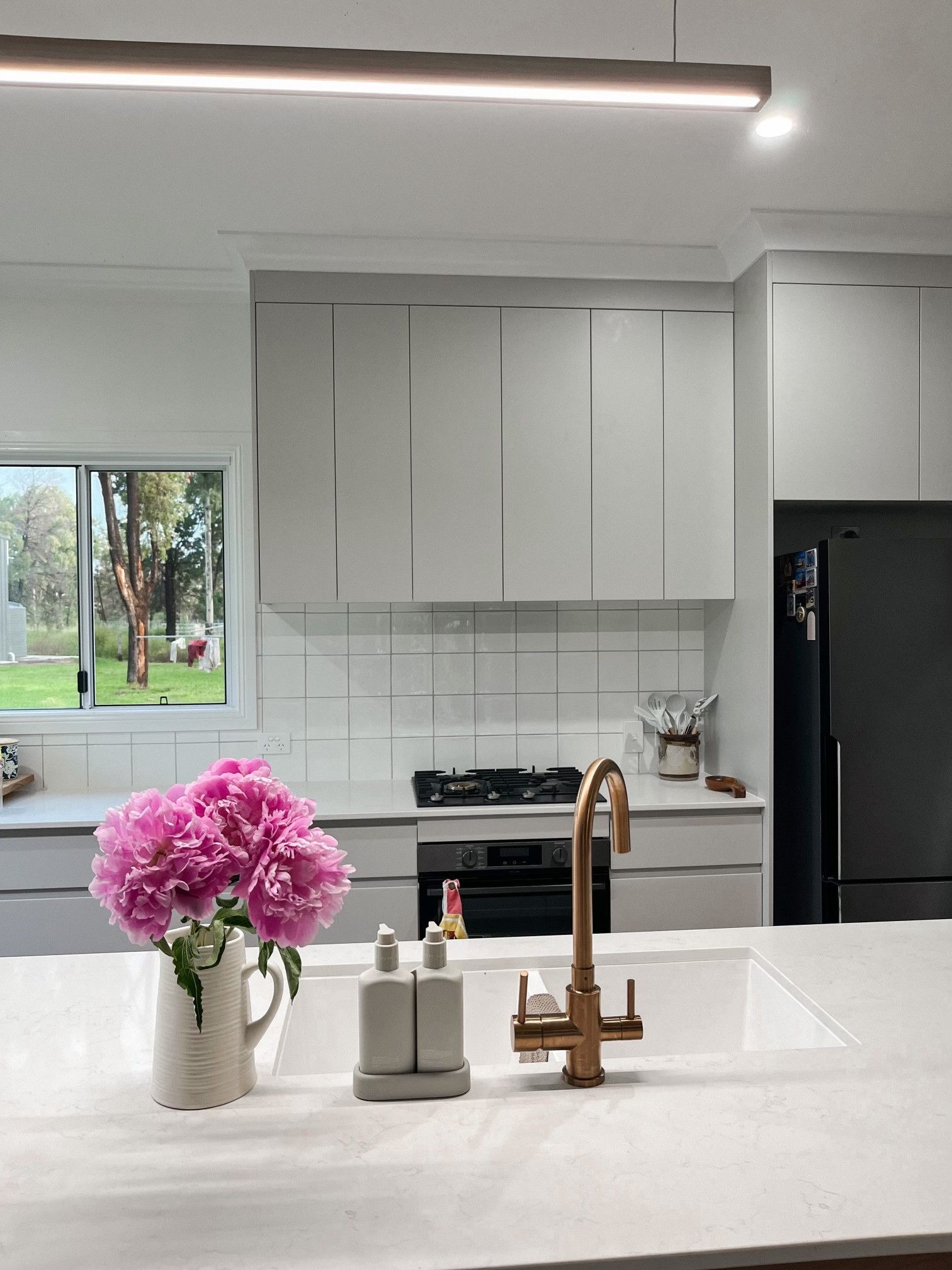 Kitchen with White Marble Countertop, Green Scalloped Backsplash, and White Cabinets — Valley Cabinetmakers In Biloela, QLD 