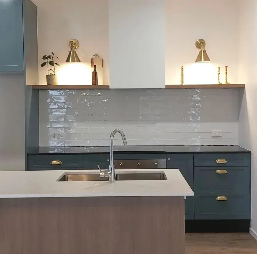 Modern Kitchen with Teal Cabinets, Light Backsplash, and Two Brass Sconces — Valley Cabinetmakers In Biloela, QLD 