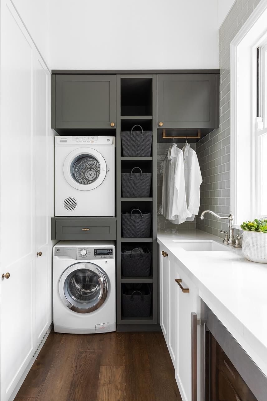 White Laundry Room with Stacked Washer/dryer, Sink, Pull-Out Hamper, and Cabinet Storage — Valley Cabinetmakers In Biloela, QLD 