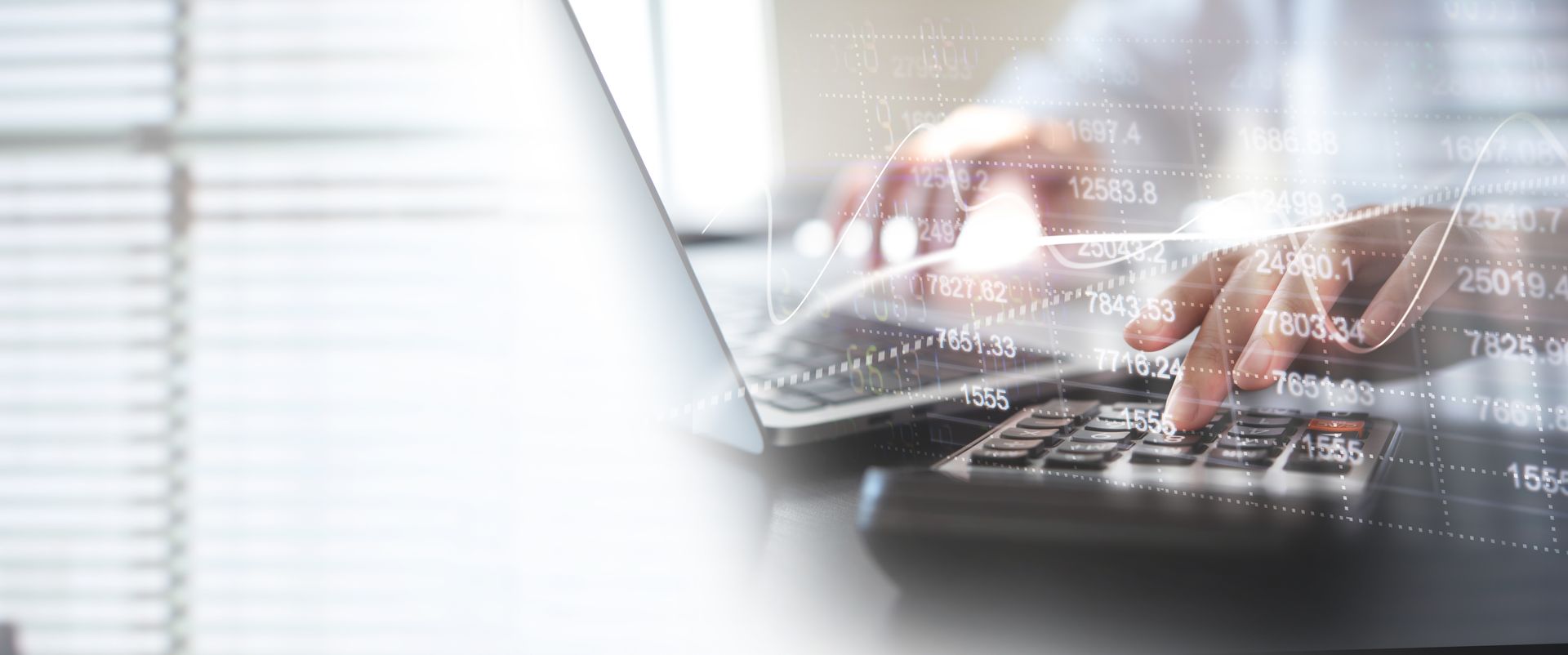 A person is typing on a laptop computer.