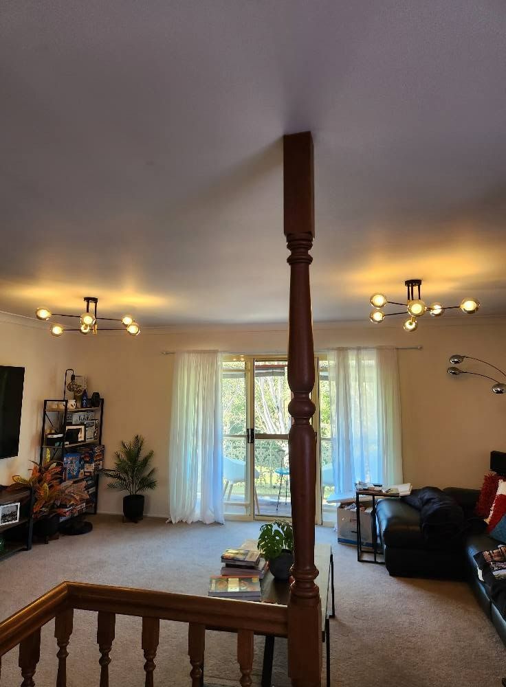 Living Room Interior With a Decorative Wooden Pillar — Wetzel Electrical in Dapto, NSW