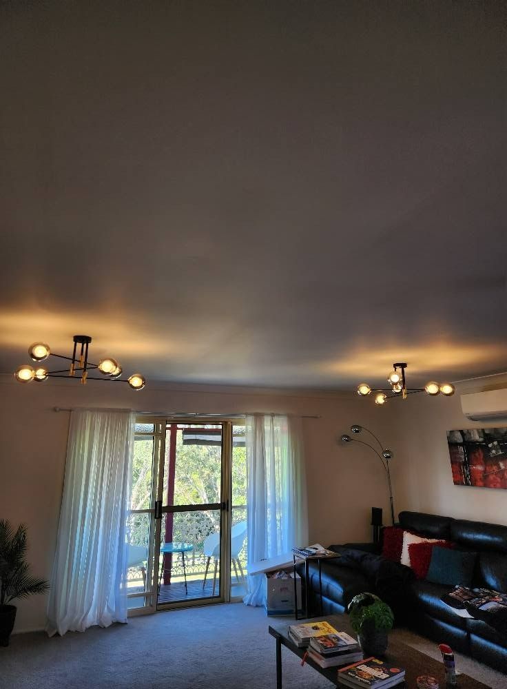 Living Room With Two Modern Light Fixtures — Wetzel Electrical in Dapto, NSW