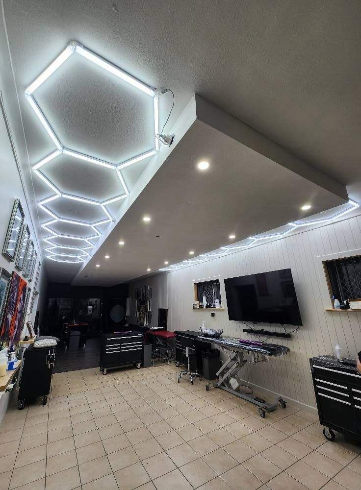 Interior of a Barbershop With Hexagonal Ceiling Lights — Wetzel Electrical in Dapto, NSW