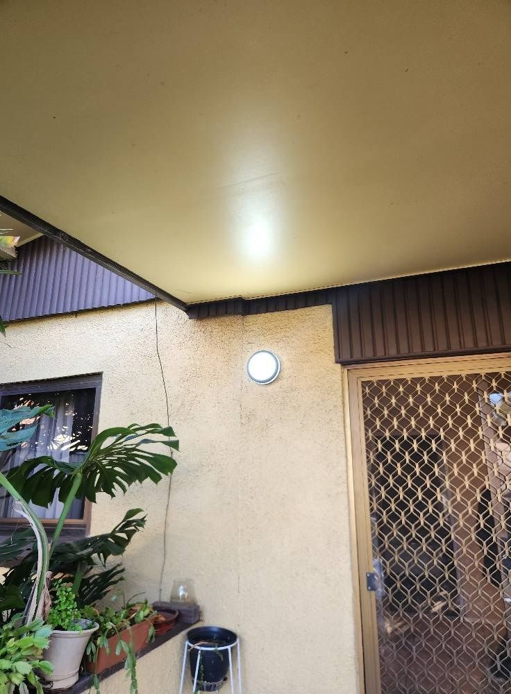 Exterior View of a Building With a Light Fixture on the Wall — Wetzel Electrical in Wollongong, NSW