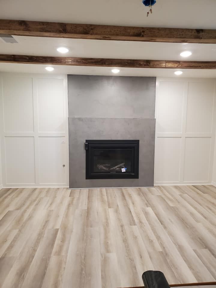 There is a fireplace in the middle of the room.