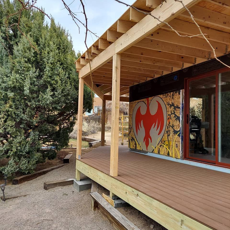 A wooden deck with a painting of a bird on it
