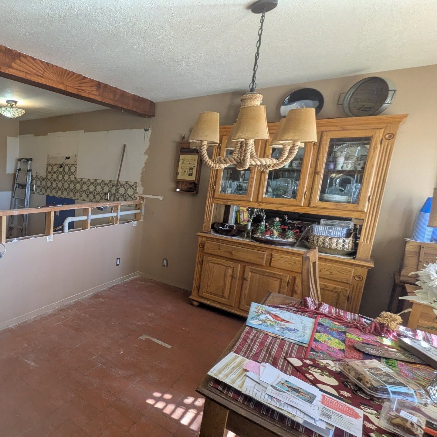 A dining room with a hutch and a table