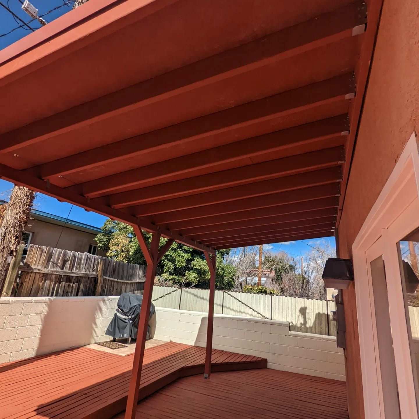 A wooden deck with a canopy over it