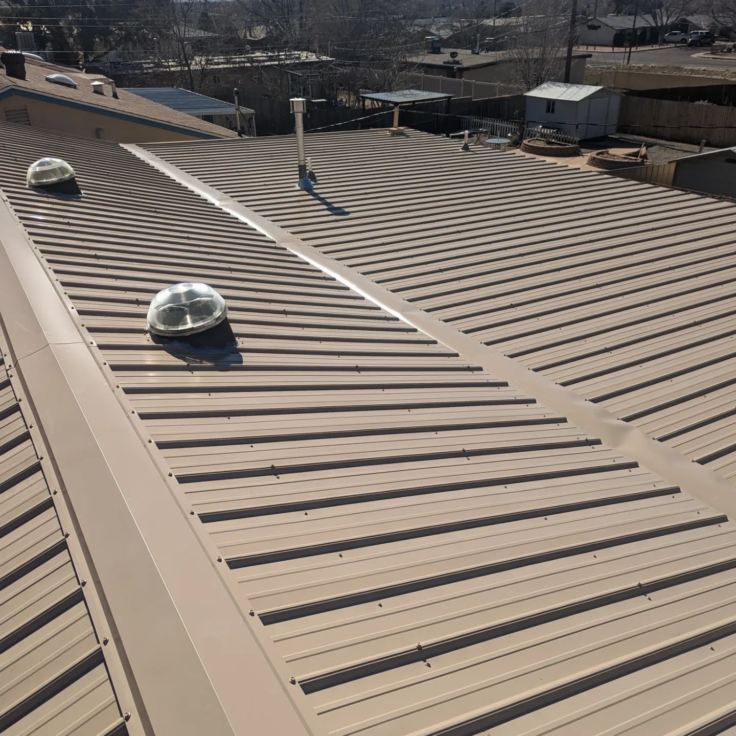 A close up of a roof with a skylight on it