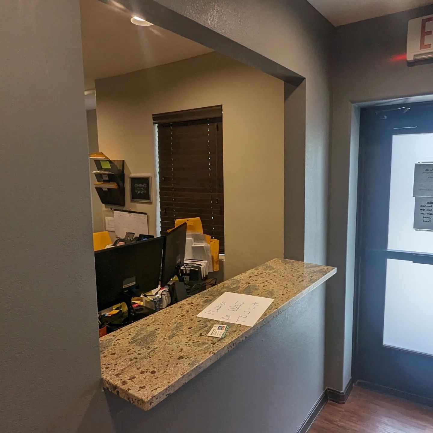 A dental office with a counter and a computer on it.