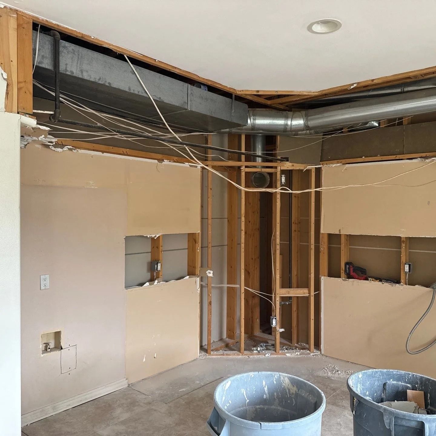 A room with a lot of wooden walls and a ceiling that is being remodeled.