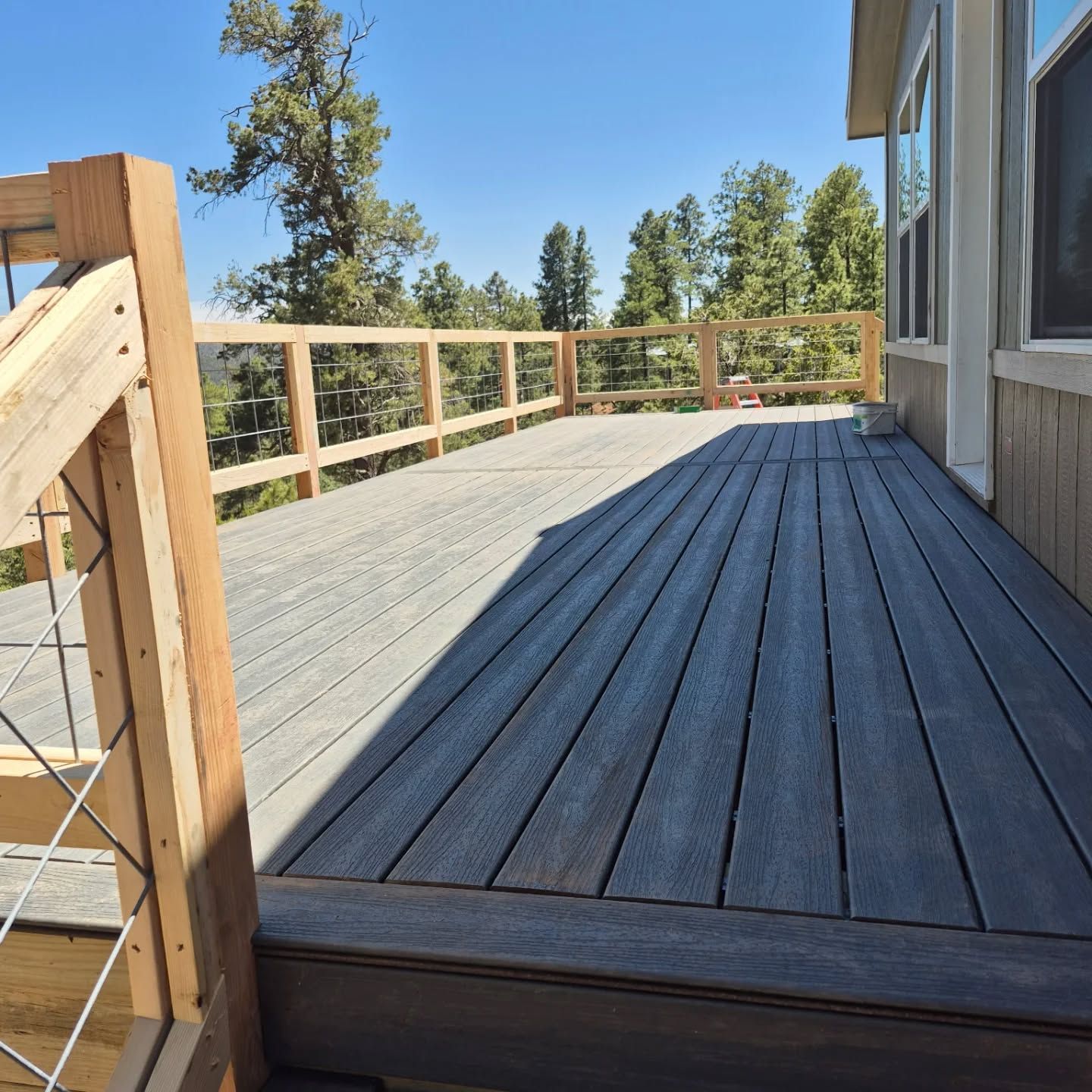 A wooden deck with stairs leading up to it
