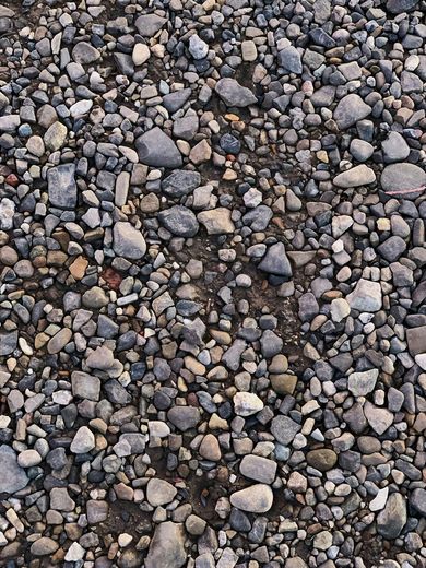 A pile of rocks and dirt on the ground.