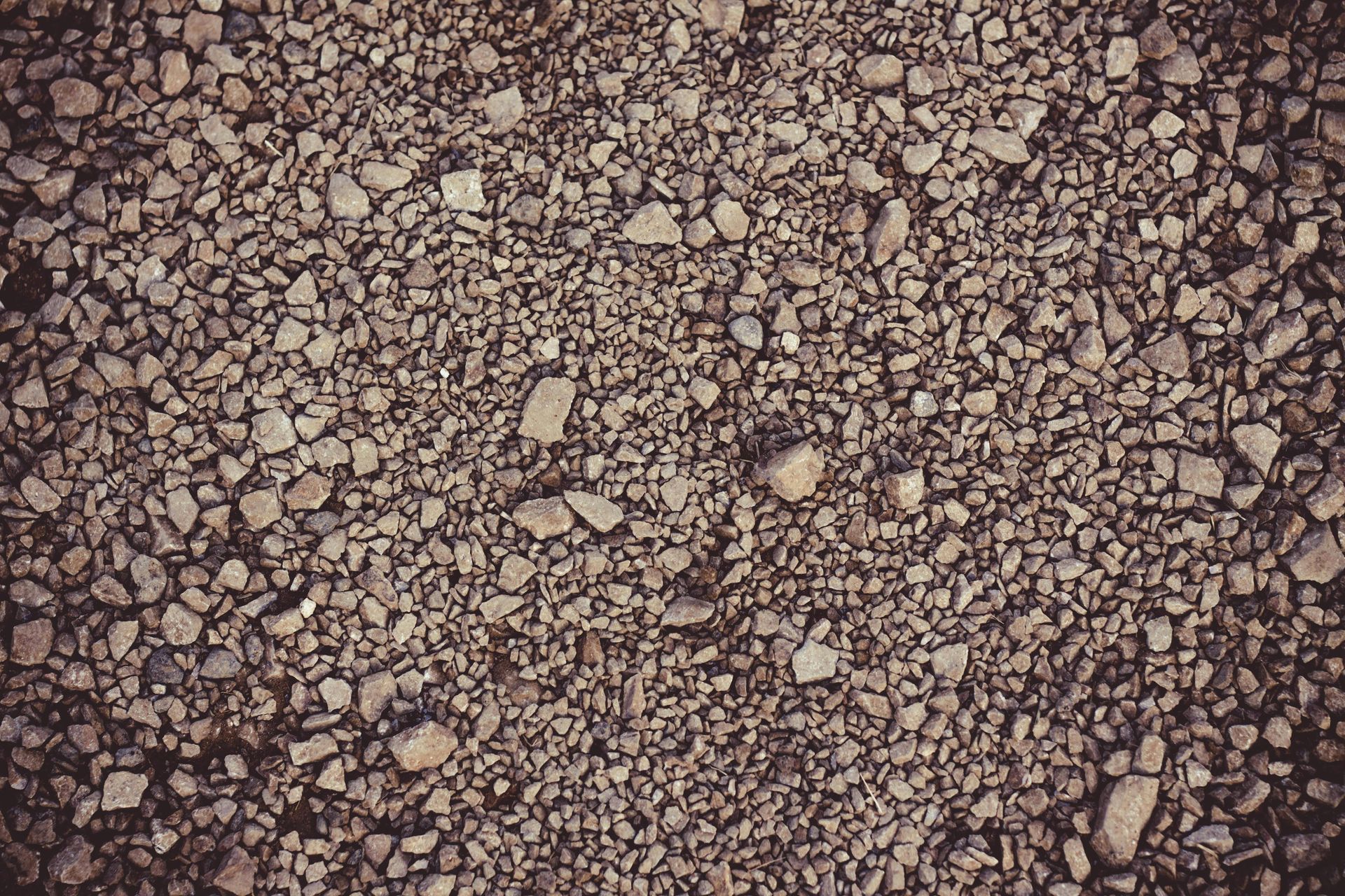 A close up of a pile of gravel on the ground.