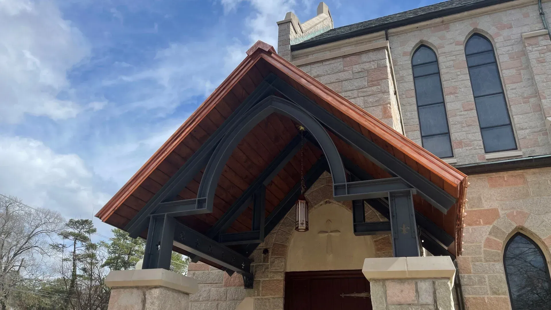 A church with a wooden roof and arched windows