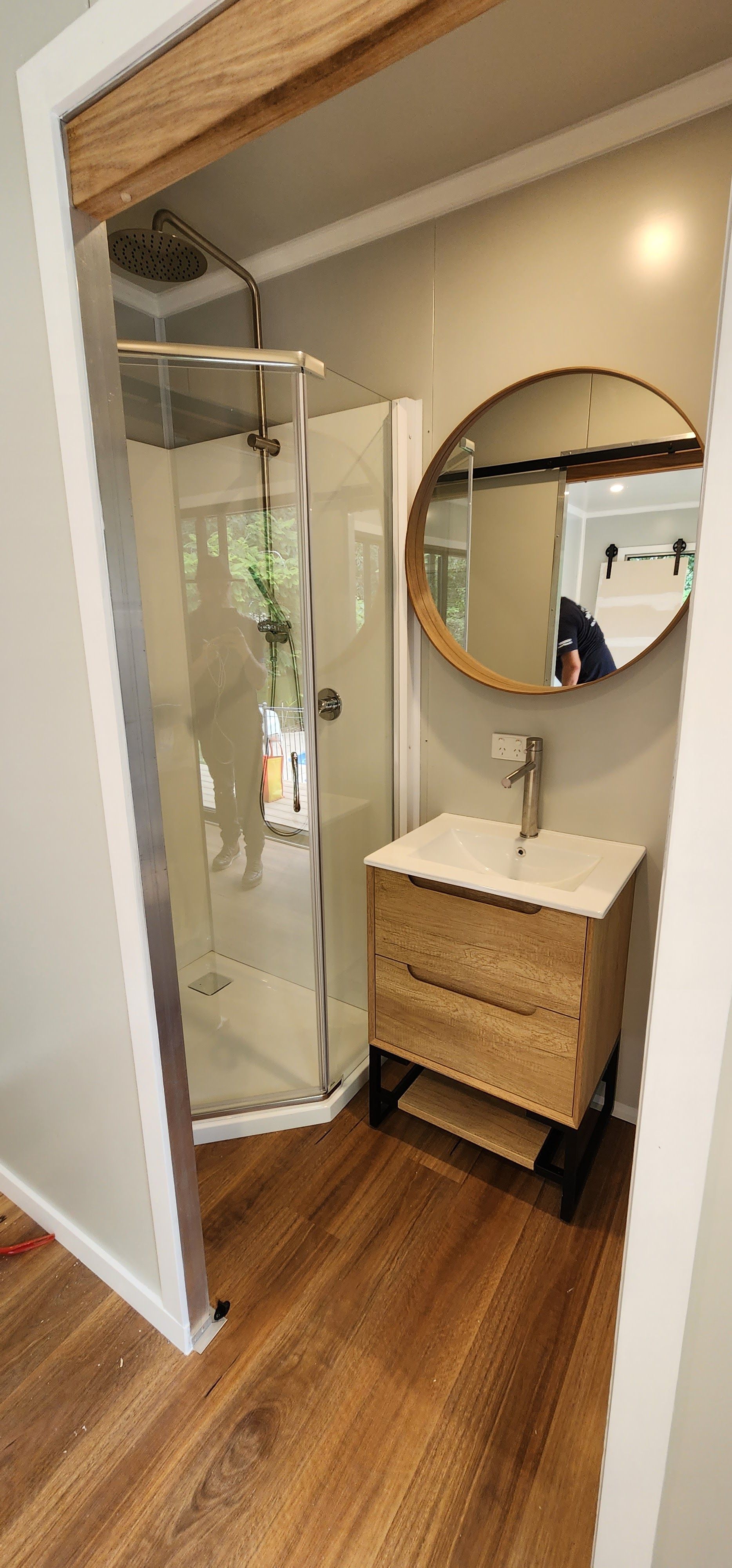 A Bathroom with A Sink, Shower and Mirror — Alternative Modular Home In Toowoomba City, QLD