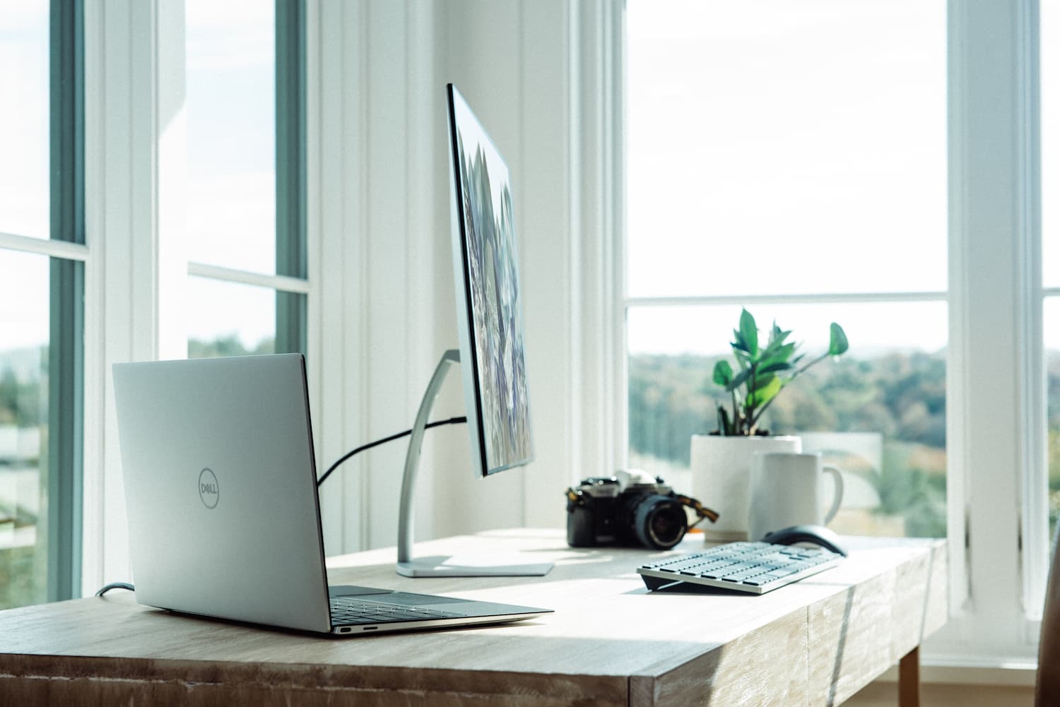 Wooden Office Table With Laptop And Monitor — Alternative Modular Home In Toowoomba City, QLD
