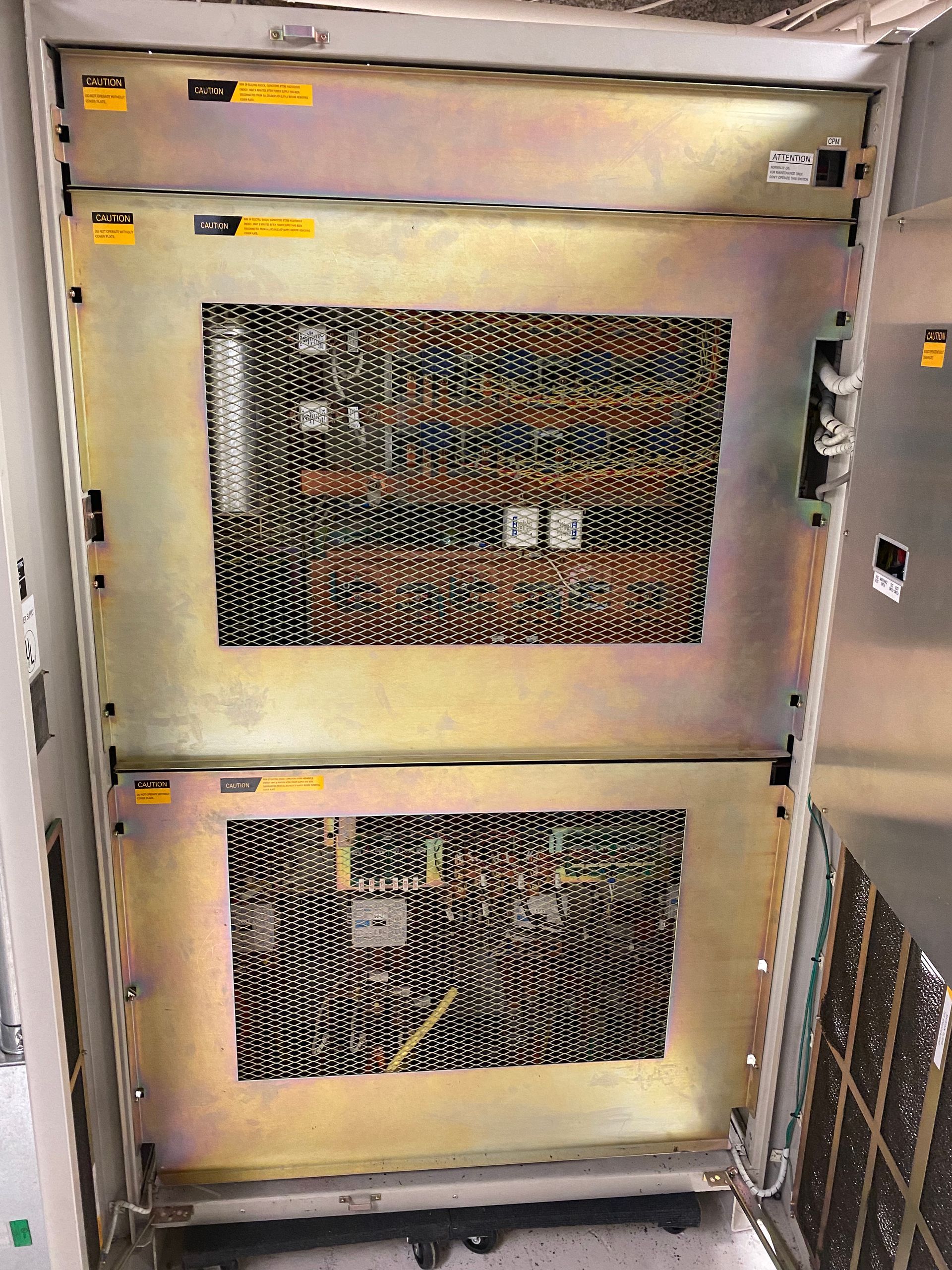 A stack of metal boxes sitting on top of each other in a room.