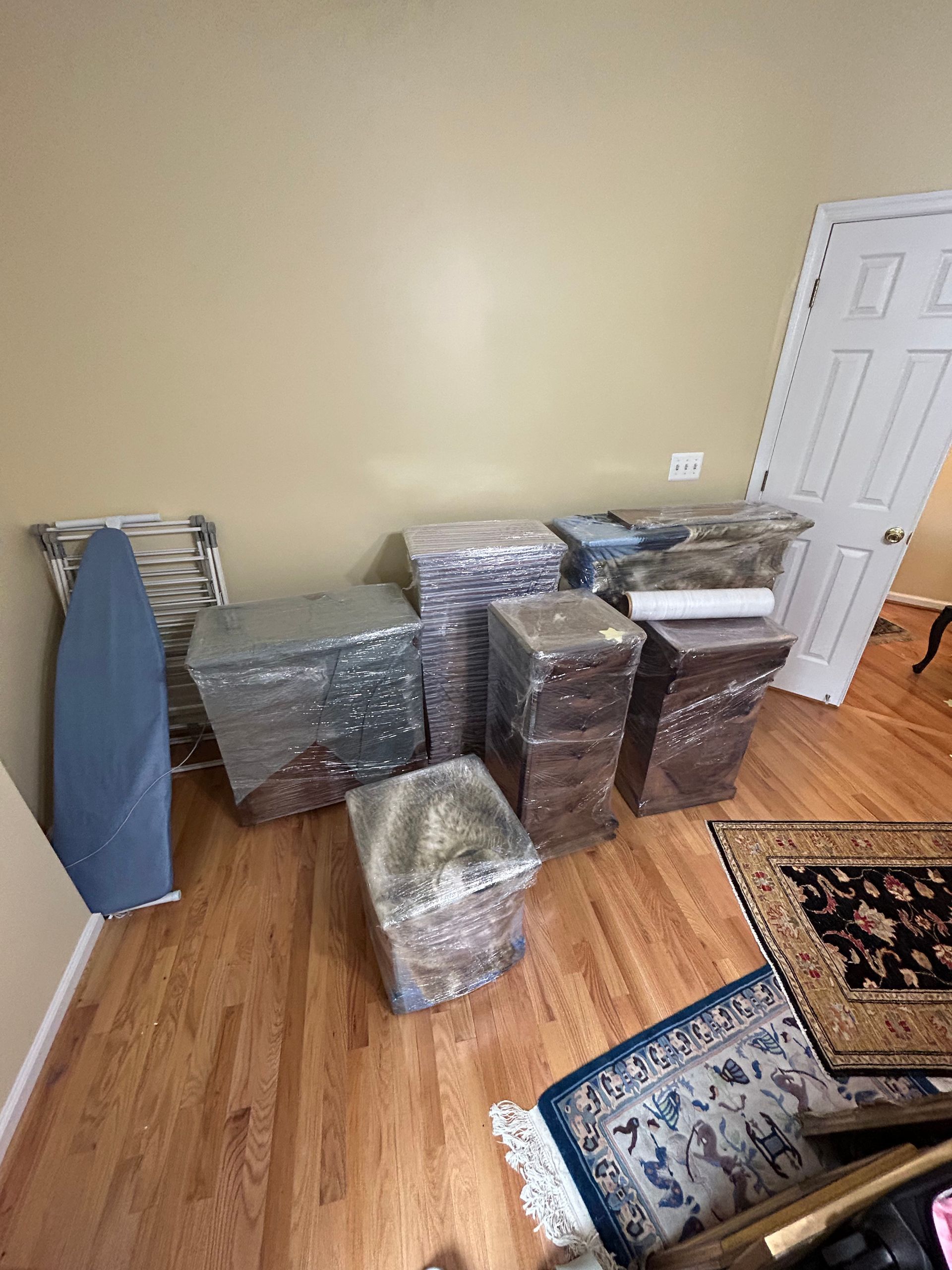 A room filled with lots of boxes wrapped in plastic.