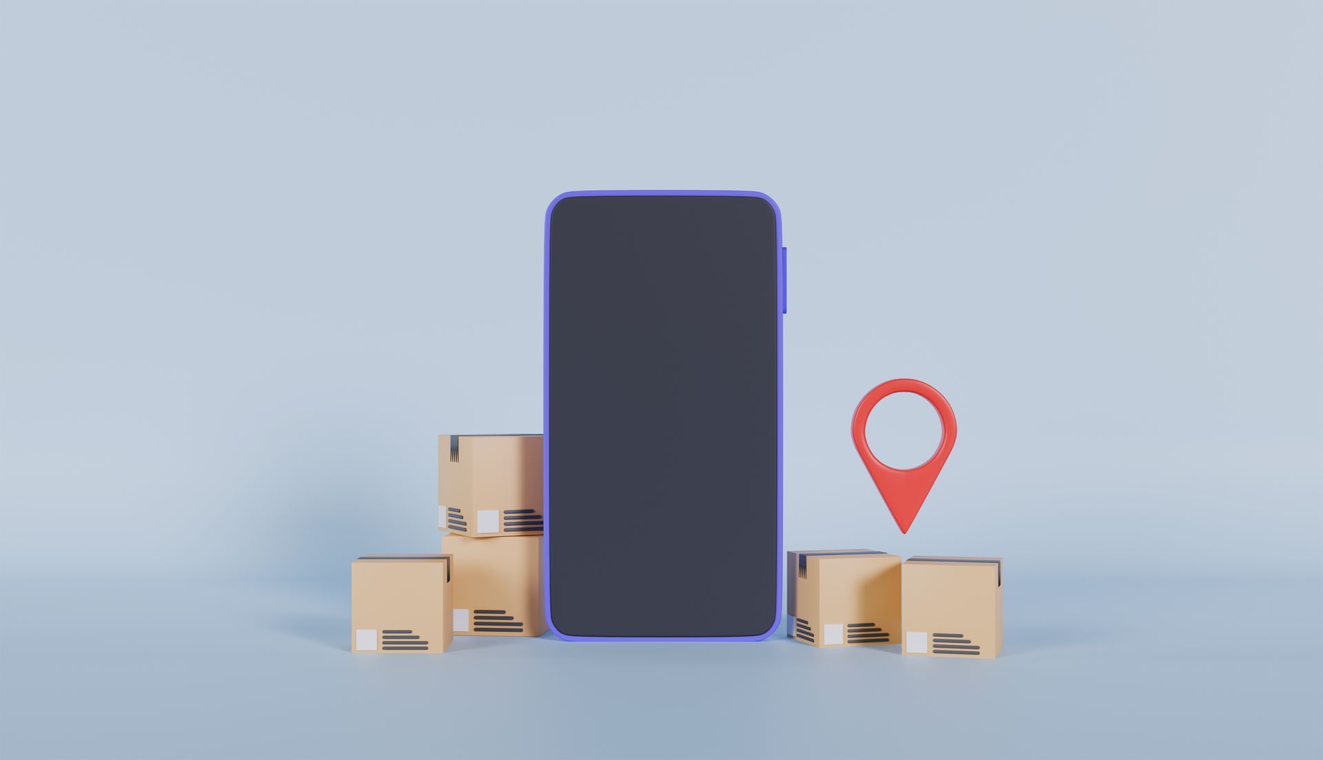 A cell phone is sitting on top of a pile of cardboard boxes.