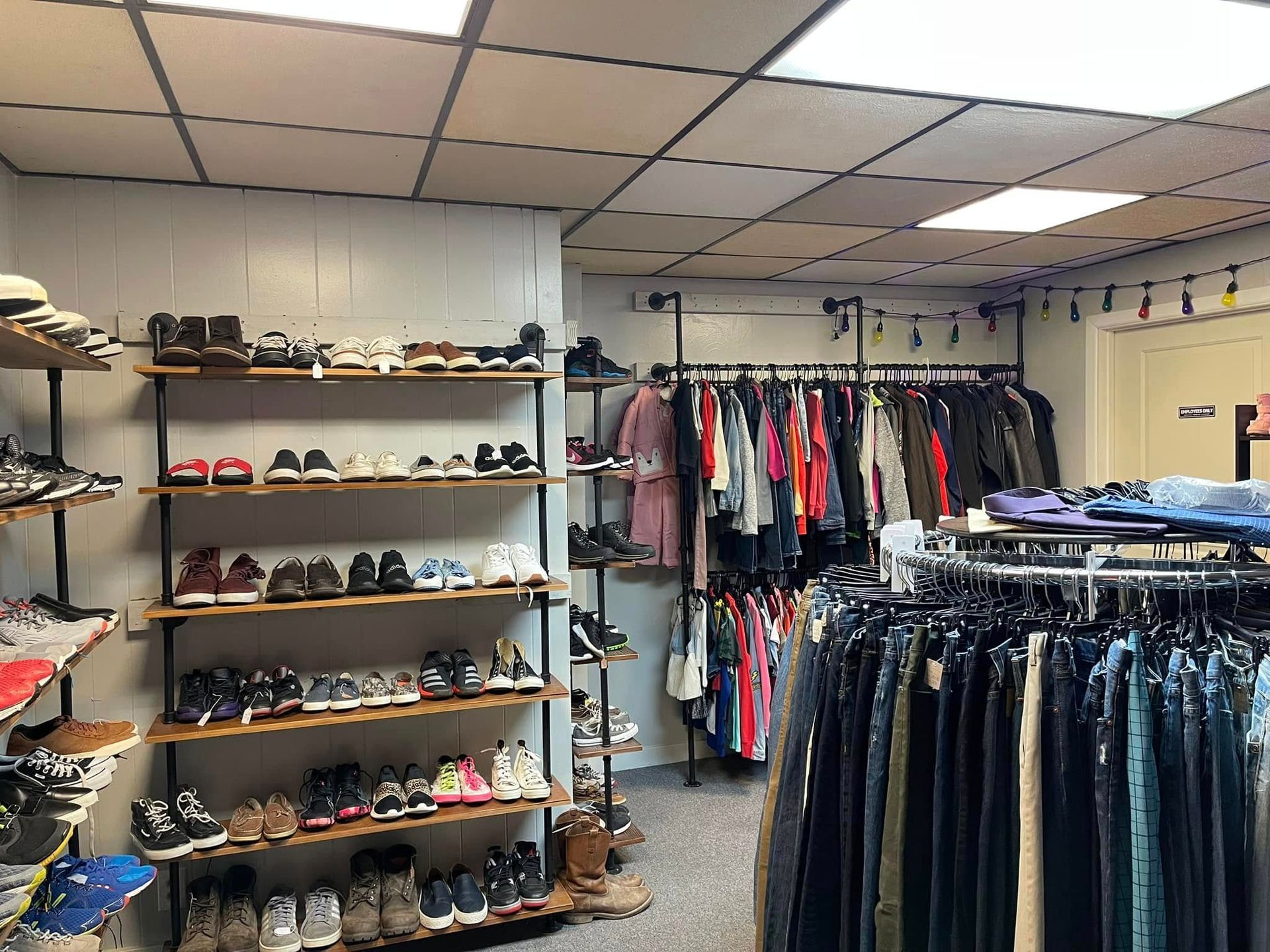 A store filled with lots of shoes and clothes.
