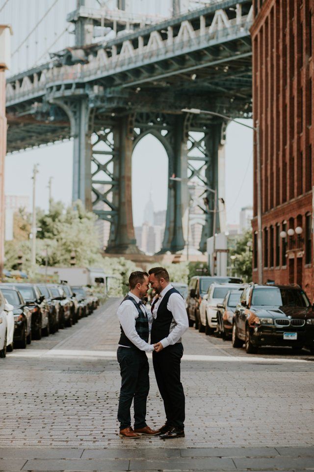 Groom and Groom stood holding hands on Brooklyn Street
